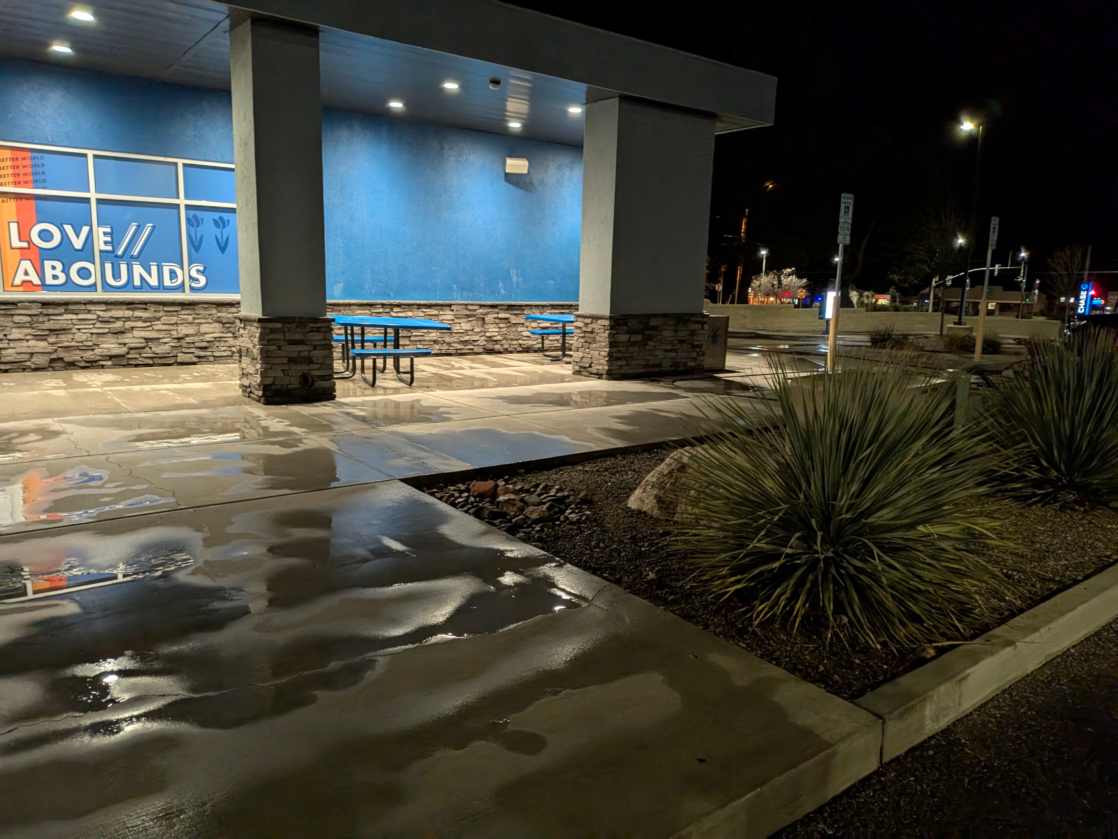 Freshly pressure washed concrete at Love Abounds commercial property in Cottonwood, AZ at night